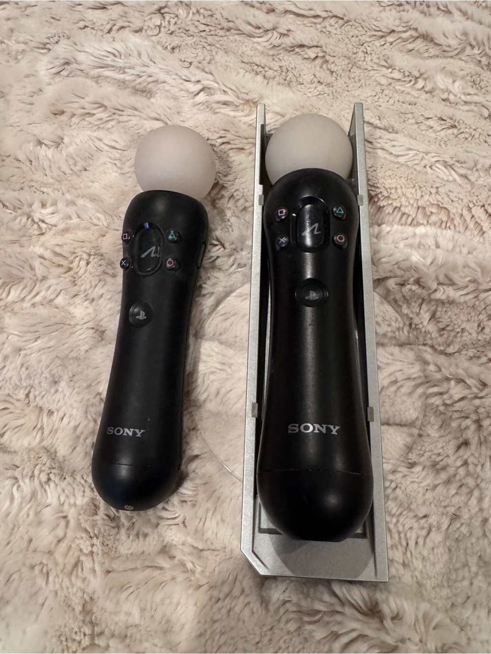 Sony Black Motion Controllers with White Orbs and Charging Stand